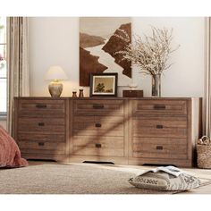 a bedroom scene with focus on the dresser and bed sideboard in the foreground