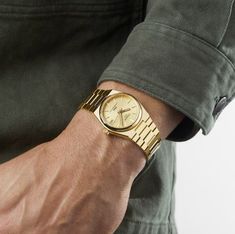 Check out the beautiful Tissot PRX Powermatic 80 Full Gold 35mm T137.207.33.021.00. An elegant golden watch for men. Tissot Prx Powermatic 80 35mm, Tissot Prx Gold, Gold Watch Outfit, Tissot Prx 35mm, Watches For Men Gold, Tissot Prx Powermatic 80, Designer Watches For Men, Gold Watches For Men, Top Watches For Men