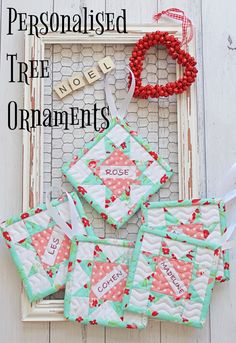 four quilted coasters sitting on top of a white frame with the words personalised tree ornaments