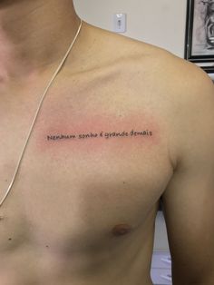 a man's chest with an inscription on it that says, remain strong and glyphied demons