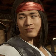 an image of a man with long hair wearing a leather vest and bandana looking at the camera