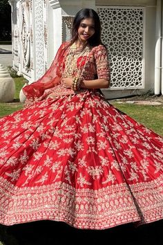 Red attached cancan flared lehenga with panelled embroidery using mix material of dabka dori, sitara sequins, zari, beads and pearls in floral motifs. Paired with a padded blouse with embroidery using similar work and a belt with coordinating mobile packet. Comes along with a veil dupatta with embroidered and kiran lace border and a second dupatta with dabka, sitara embroidery. - Aza Fashions Fitted Red Sharara With Tilla Details, Red Fitted Sharara With Tilla, Red Fitted Embellished Sharara, Red Dori Work Dress For Traditional Ceremonies, Red Dress With Dori Work For Traditional Ceremonies, Cape Lehenga, Kurta Lehenga, Lehenga Skirt, Tarun Tahiliani