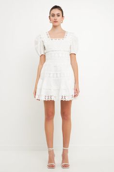 Our Lace Fit-and-Flare Mini Dress is the perfect versatile piece to add to your wardrobe. Wear it during the summer with sandals or pair it with heels and a coat for a winter holiday party. The fit-and-flare silhouette is extremely flattering and highlights your waistline, while the lace details add a feminine touch. And we made sure to add your favorite: pockets! Fit-and-flare silhouette Square neckline Lace trim detailing throughout Puffy short sleeves with elastic hems Concealed side zipper O