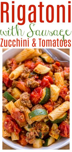 rigattoni with sausage, zucchini and tomatoes in a white bowl