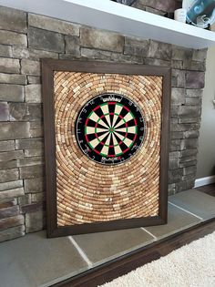 a brick wall with a dart in the center and a wooden frame around it on top of a shelf