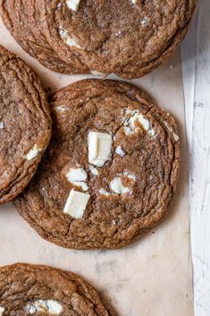 chocolate cookies with white cheese on top