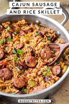 sausage and rice skillet in a pan with a wooden spoon on the side text reads cajun sausage and rice skillet