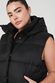 Made to mix and match into seasonal looks with ease, the cozy-luxe Gold Rush Puffer Vest is here. Its cinched design and tall, hooded collar work together to keep your core toasty by locking in heat from the waist up. Weather-ready recycled DWR ripstop Puffer vest with cinched waist Side zip pockets & internal fleece pockets Designed & uniquely fit to flatter every size Wear-tested by our in-house team for the perfect fit Alo Yoga Winter Outdoor Outerwear, Alo Yoga Hooded Outerwear With Drawstring, Alo Yoga Winter Streetwear Outerwear, Alo Yoga Hooded Outerwear For Winter, Cozy Black Outerwear With Drawstring Hood, Cozy Black Outerwear With Adjustable Hood, Alo Yoga Fall Outerwear With Drawstring Hood, Alo Yoga Outerwear With Drawstring Hood For Fall, Alo Yoga Drawstring Hood Outerwear For Fall