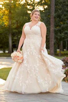 a woman in a wedding dress walking down the street