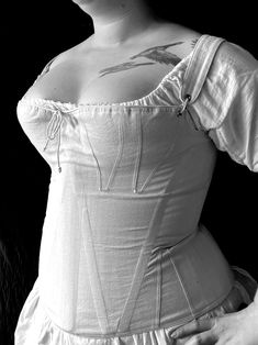 With the waist high under the bust, our c. 1805 "Patricia" corset shapes the body with gussets at the top giving roundness to the bust. This corset features a removable center front wooden busk that lifts and separates the bust as was the fashion of the day. This style has shoulder straps attached with adjustable front lacing. These corsets feature: Ø Side seam alteration point for an adjustable fit  Ø Center back lacing Ø Adjustable or removable shoulder straps Ø Removable front wooden busk Ø Fabric has been pre-washed so you can hand wash your corset without any worry about shrinking Please provide your measurements at checkout for a custom fit -Bust -Waist -Hip -Center back nape to waist (from the base of your neck to your natural waist) -Height -Outseam see our size chart here: https:/ Jane Austen Costume, Regency Gown, Romantic Era, Underbust Corset, Corset Lingerie, Costume Cosplay, Downton Abbey, Up Girl, Historical Fashion