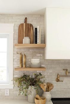 the kitchen counter is clean and ready to be used as a shelf for cooking utensils