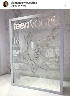 the front cover of teenvogte magazine on display in a marbled room