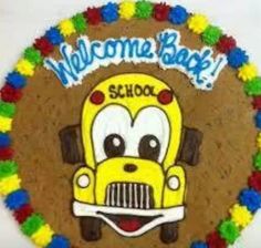 a school bus cake with the words welcome back on it