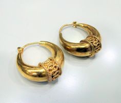 Vintage 14 K solid Gold Hallmarked Hoop Earrings Pair. Size-2.5 cm, weight of pair-18 grams. Traditional Engraved Round Hoop Earrings, Traditional Engraved Hoop Earrings, Ceremonial Yellow Gold Round Earrings, Yellow Gold Crescent Hoop Earrings, Elegant Hoop Earrings For Ceremonial Occasions, Traditional Hallmarked Round Hoop Earrings, Traditional 14k Gold Round Earrings, Heirloom Hallmarked Round Earrings, Heirloom Hallmarked Earrings