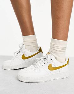 Nike Air Force 1 '07 Next sneakers in white and bronze | ASOS Sporty Ankle-high Sneakers With Perforated Toe Box, Nike Gold Sneakers For Streetwear, Gold High-top Sneakers With Perforated Toe Box, Gold Sneakers With Contrast Sole For Streetwear, Gold Low-top Sneakers With Contrast Sole, Nike Gold High-top Sneakers, Sporty Gold Sneakers For Streetwear, Gold High-top Sneakers With Contrast Sole, Nike Custom Gold Low-top Sneakers