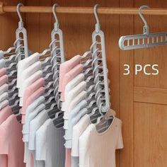 there is a rack with clothes hanging on it and the number three pics below