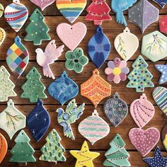 decorated christmas cookies are displayed on a table