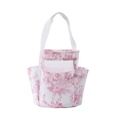 two bags with pink flowers on them, one in white and the other in pink