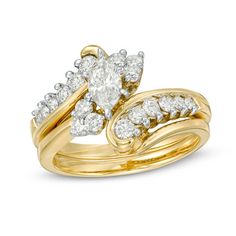 two gold wedding rings with diamonds on each one and an engagement ring in the middle