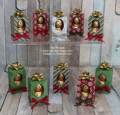 six small boxes with christmas decorations in them