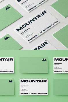 several business cards are stacked on top of each other, with the word mountain printed on them