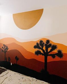 a bed room with a painting on the wall and a palm tree in the foreground