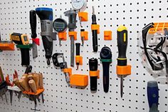 there are many tools hanging on the wall