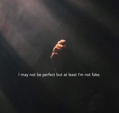 a person's hand with the words i may not be perfect but at least i'm not fake