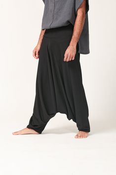 This beautiful and comfortable Origami Drop Crotch harem pants are made by folding the fabric. The thickness of the fabric gives these pants a more structured look. These pants are suitable for both men and women... They are chic, Stylish and always with a statement! MATERIAL : CREPE JERSEY SIZES: ONE SIZE Waist: 80-90cm Length: 107cm COLOR: Black Care instructions: - Turn garment inside out before washing - Hand wash in cold water separately from other garments - Do not bleach - Do not harshly Black Wide-leg Yoga Pants, Solid Relaxed Fit Harem Pants, Relaxed Fit Solid Harem Pants, Baggy Full Length Harem Pants For Yoga, Baggy Full-length Harem Pants For Yoga, Baggy Yoga Pants With Drop Crotch, Black Harem Yoga Pants, Black Harem Pants Lagenlook Style, Black Harem Pants In Lagenlook Style