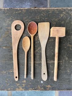 three wooden spoons and two wooden spatulas