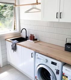 a washer and dryer in a small kitchen