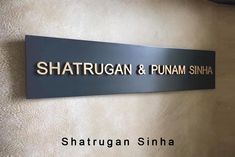 the sign on the wall says shatrugaan & punam sinha,