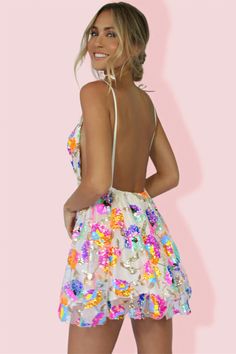 No one will be able to forget the way you sparkle in the Blissful Goddess Sequin Backless Mini Dress! Clusters of sparkly multi-color sequins create a floral blossom pattern across mesh fabric shapes this flirty a-line style that features a plunging v-neckline with shoulder tie detailing and an elastic waist band atop mini skirt. Hidden back zipper/clasp. Keep it simple with a dainty necklace or dress it up with statement jewelry and cute heels. Mesh, Polyester. Lined. Runs true to size. Hand Wa Rainbow Sequin Dress, White Lilac, Cute Heels, Backless Mini Dress, Cardigan Sweater Jacket, Gothic Dress, Sequin Mini, Tulle Fabric, Crop Top Blouse