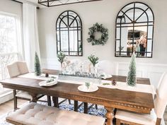 the dining room table is set for christmas dinner