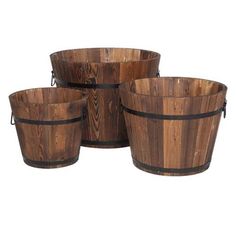 four wooden buckets are stacked on top of each other