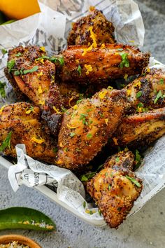 chicken wings with herbs and seasoning in a basket