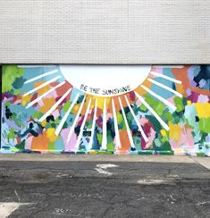 a mural painted on the side of a building with words be the sunshine above it