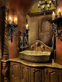 an old world bathroom with candles on the wall