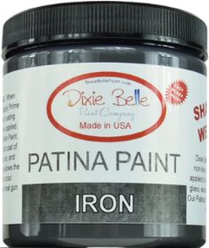 a jar of iron paint sitting on top of a table