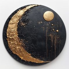 a black and gold plate with a moon on it