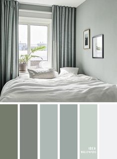 a bedroom with gray walls and curtains, white bedding, and grey drapes