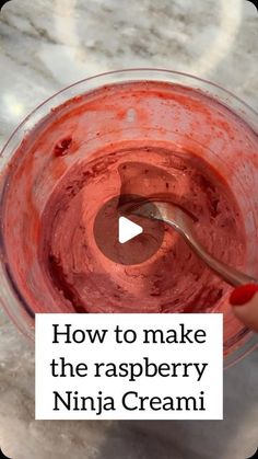 a hand holding a spoon in a glass bowl filled with red liquid and the words how to make the raspberry ninja cream