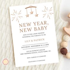 a new year's eve baby shower is shown next to some toys and decorations