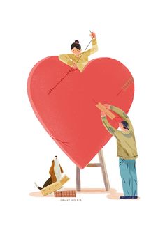 a man holding a giant heart on top of a stool