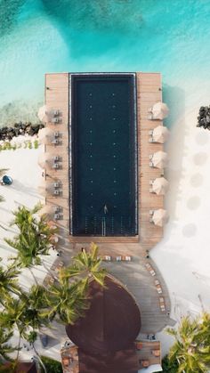 an aerial view of the pool and beach