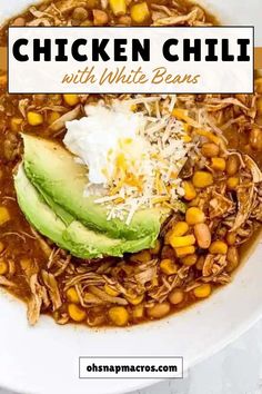 chicken chili with white beans and avocado in a bowl on top of a table