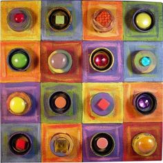 an art work with many different colored circles and shapes on it's surface,