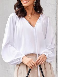 Casual style. European design. Bomber sleeves, with elastic at the wrists and a front. V-neckline. Color may be lighter or darker depending of the device it is displayed. Chic White Stretch V-neck Top, Chic White V-neck Blouse, Chic White V-neck Top For Fall, White V-neck Top For Fall, European Design, European Designs, White Top, White Tops, Casual Style