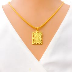 Meticulously designed in radiant 22k yellow gold, this rectangular pendant showcases an ornate Khanda motif. Weighing 2.8 grams and measuring 1.25" in length, it embodies spirituality with an exquisite finesse. Note: Chain not provided. PRODUCT DETAILS Gold Purity(karat): 22k Gold Weight(grams): 2.8 Item Finish: Yellow Gold Pendant Length: 1.25" Chain: Not Included Traditional Gold Rectangular Necklace, Yellow Gold Pendants, 22k Gold, Gold Pendant, Spirituality, Yellow Gold, Chain, Pendant, Yellow