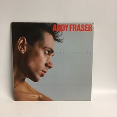 an ad for andy fraser on a white wall with a man's face